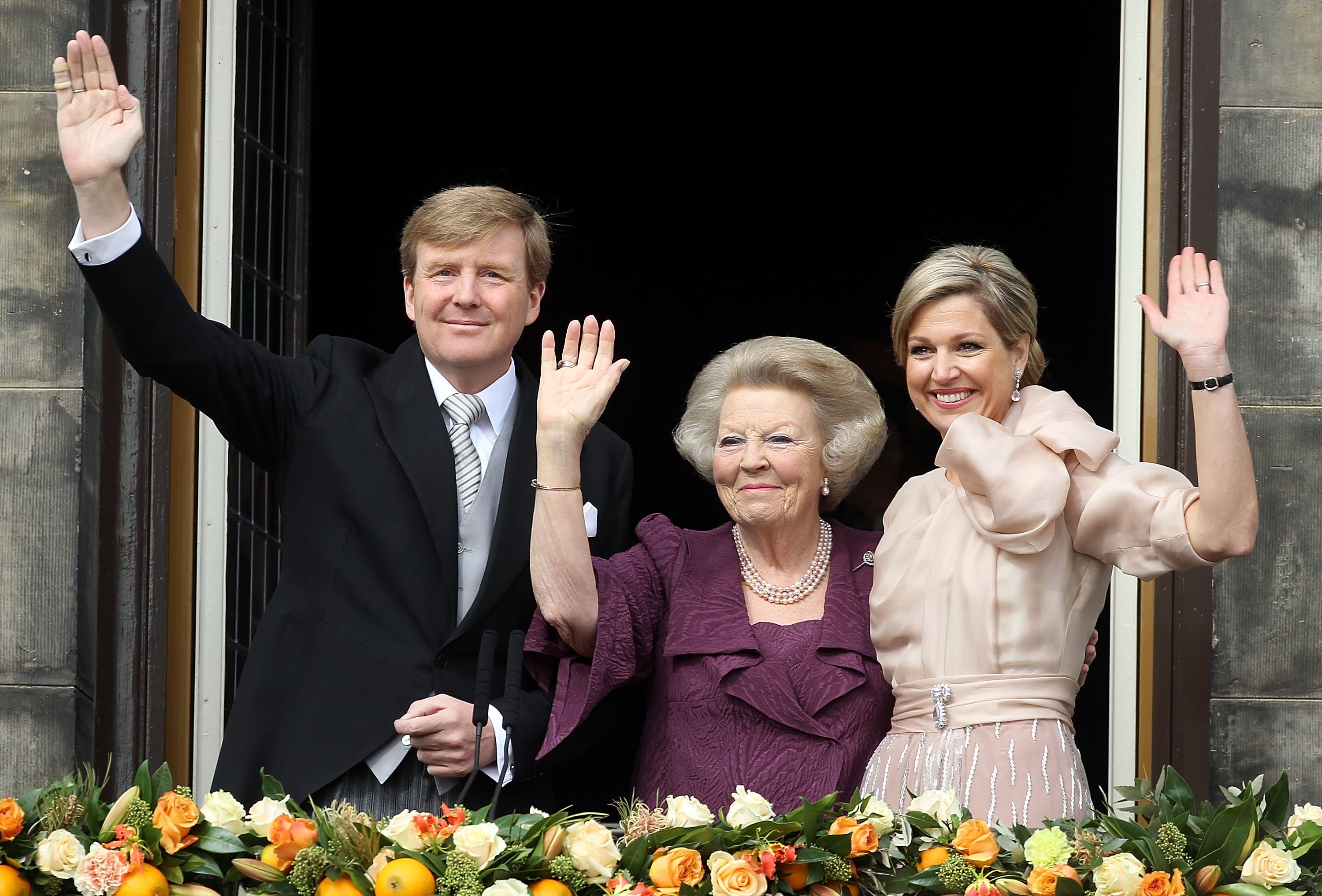 309999 King Willem-Alexander of the Netherlands, Princess Beatrix of the Netherlands and Queen Maxima of the Netherlands appear on the balcony of the Royal Palace after the abdication of Queen Beatrix, Amsterdam, Netherlands, April 30, 2013. (Getty Images Photo)