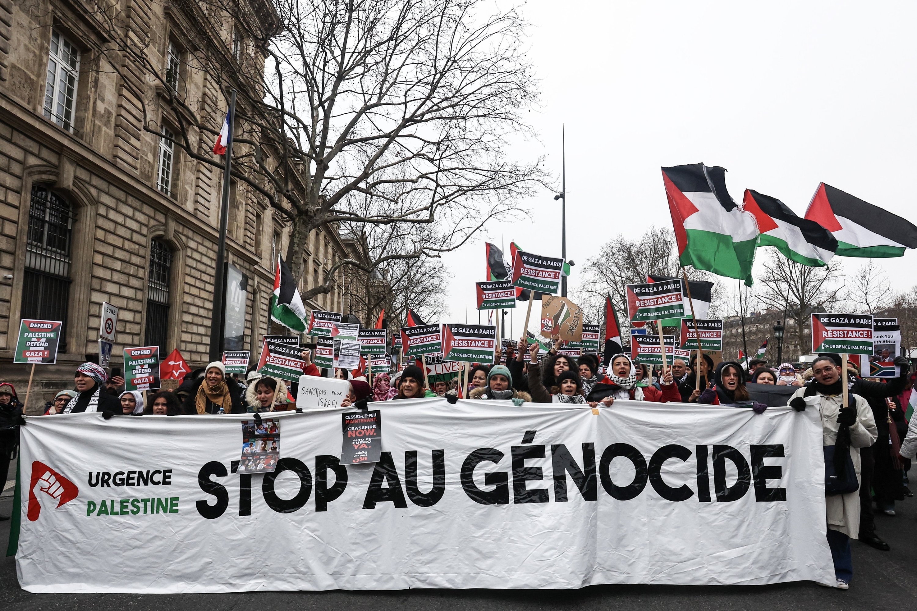 310078 Pro-Palestinian protesters carry a banner that reads 'Stop the genocide' during a march in solidarity with the Palestinian people, Paris, France, Jan. 13, 2024. (EPA Photo)
