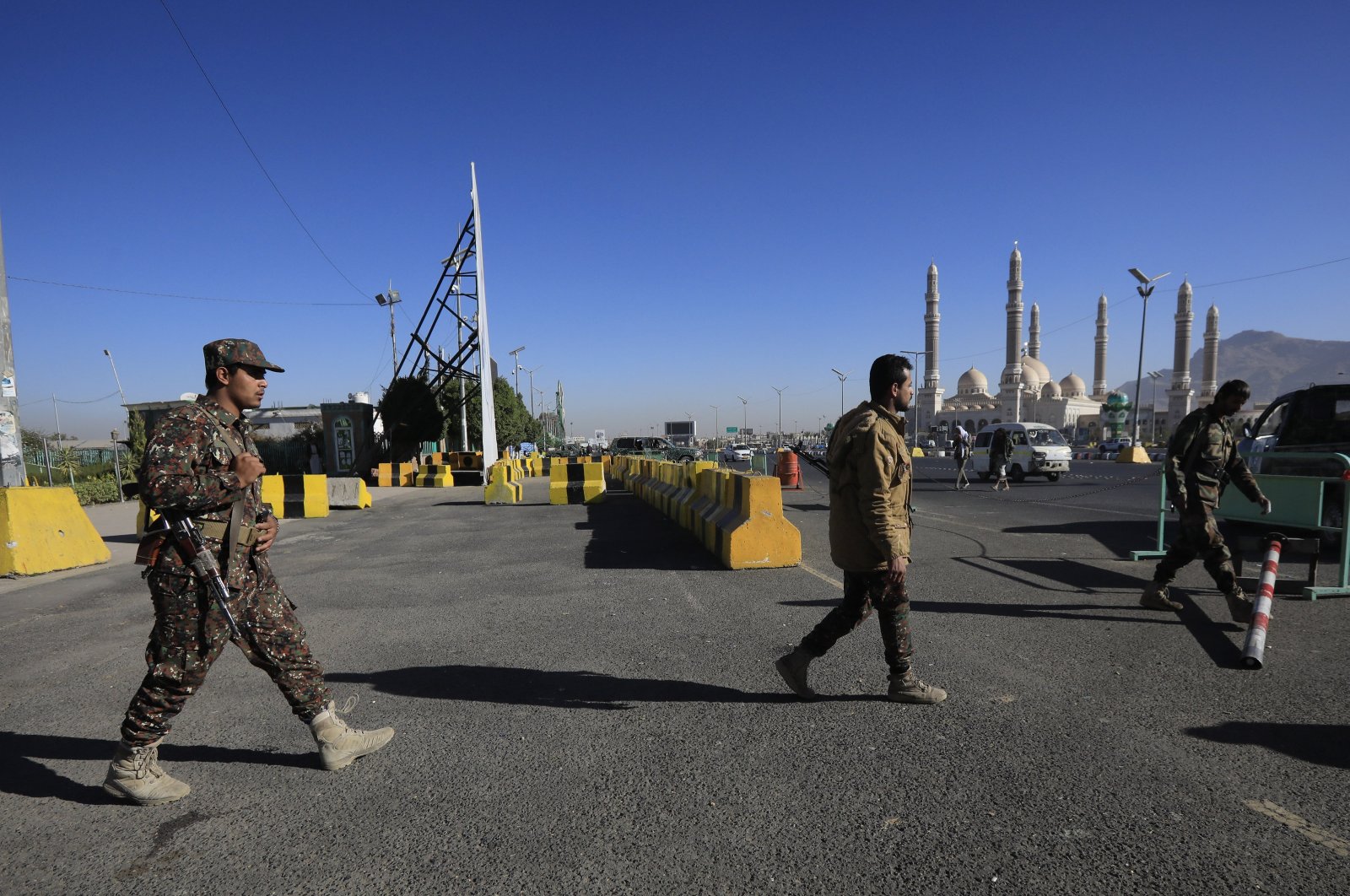 Houthi troopers patrol at a shrine of slain Houthi fighters, in Sana'a, Yemen, Jan. 17, 2024. (EPA Photo)