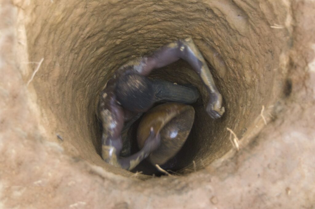 This undated photo shows a worker at an unregulated gold mine in Mali. (Getty Images)