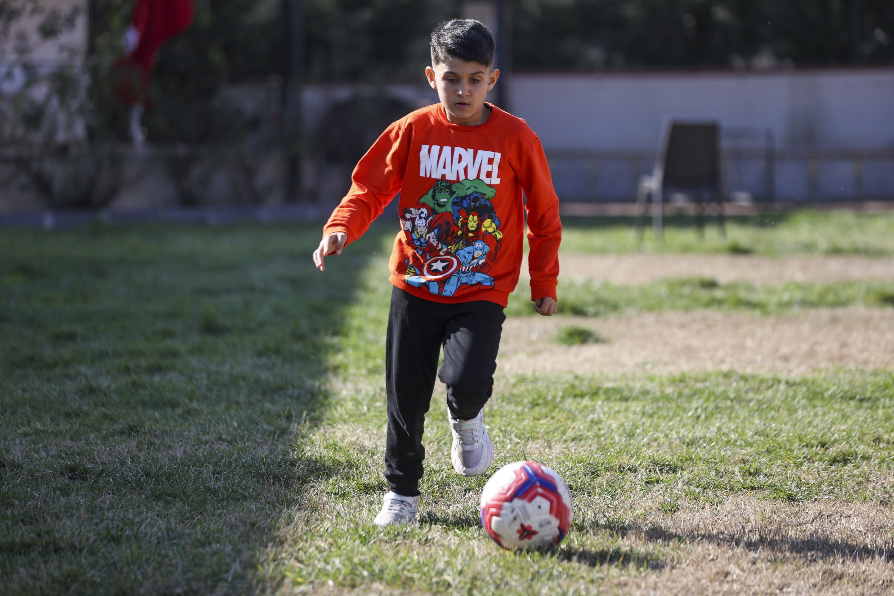 313416 Southeastern Türkiye earthquake survivor Semih Ege Inci plays football, Gaziantep, Türkiye, Feb. 5, 2024. (AA Photo)