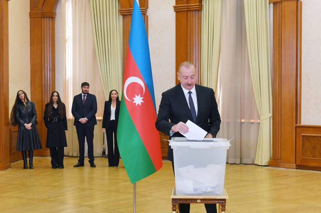 Azerbaijani President and presidential candidate Ilham Aliyev casts his ballot at a polling station during Azerbaijani snap presidential election, in the city of Khankendi in the Karabakh region on Feb. 7, 2024. (Photo by Handout / Azerbaijani presidency / AFP)