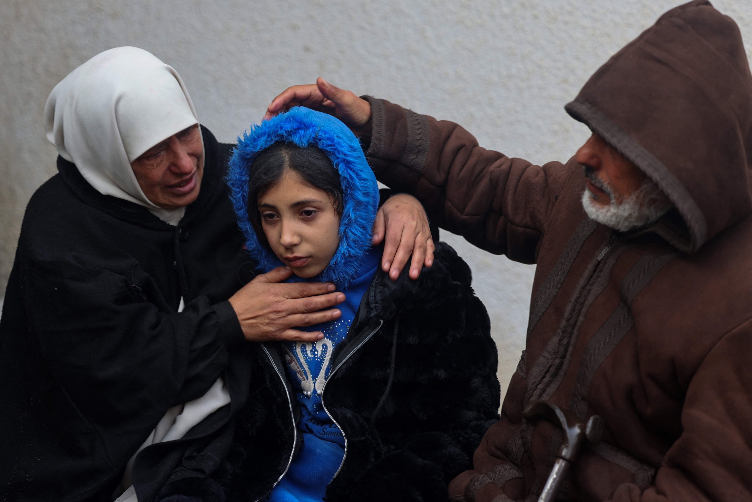 314179 Relatives comfort a Palestinian girl who lost loved ones in an Israeli attack, Rafah, southern Gaza Strip, Palestine, Feb. 9, 2024. (AFP Photo)