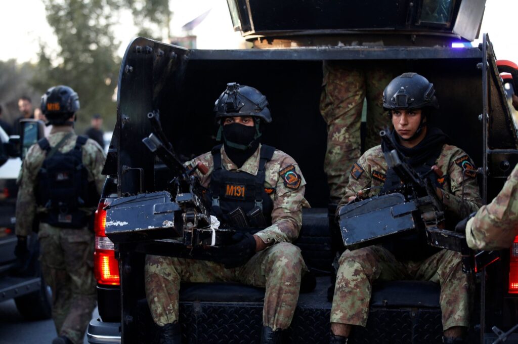Members of Iraq's Hashd al-Shaabi (Popular Mobilization) keep guard during the funeral of Abu Baqr al-Saadi, a prominent leader in the Kataeb Hezbollah who was killed in a strike carried out a day earlier by an American drone that targeted his car in a vital neighborhood in Baghdad, on Feb. 8, 2024. (AFP Photo)