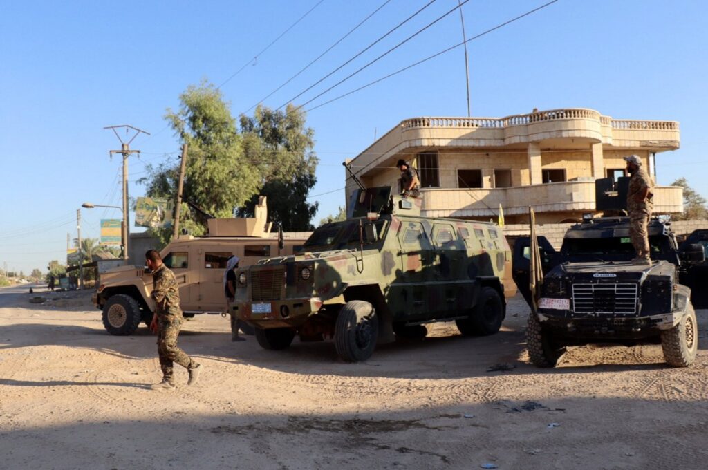 Militants of the U.S.-backed PKK/YPG terrorist group take up positions in the town of Dhiban, Deir el-Zour province, eastern Syria, Sept. 9, 2023. (EPA Photo)