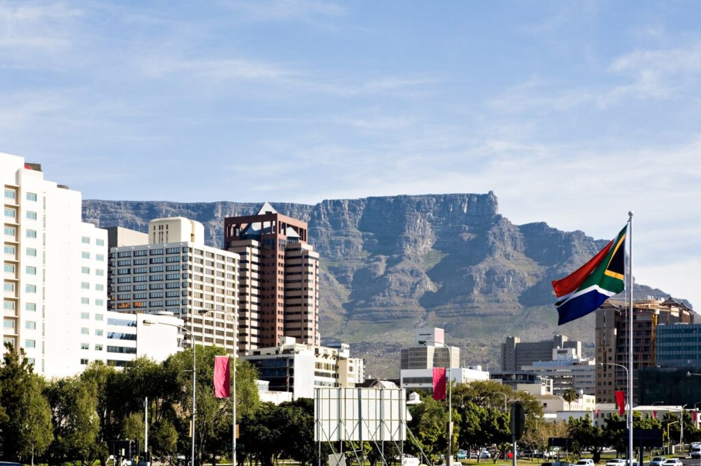 The Table Mountain rises behind downtown Cape Town, South Africa. (Getty Images Photo)