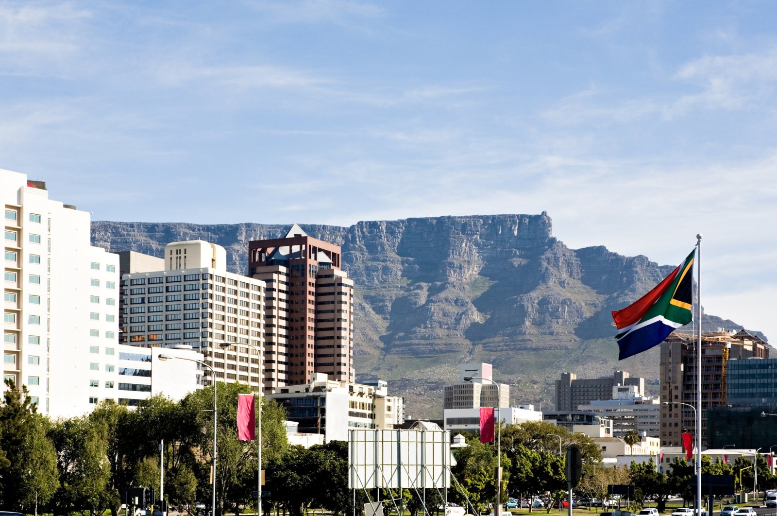 The Table Mountain rises behind downtown Cape Town, South Africa. (Getty Images Photo)