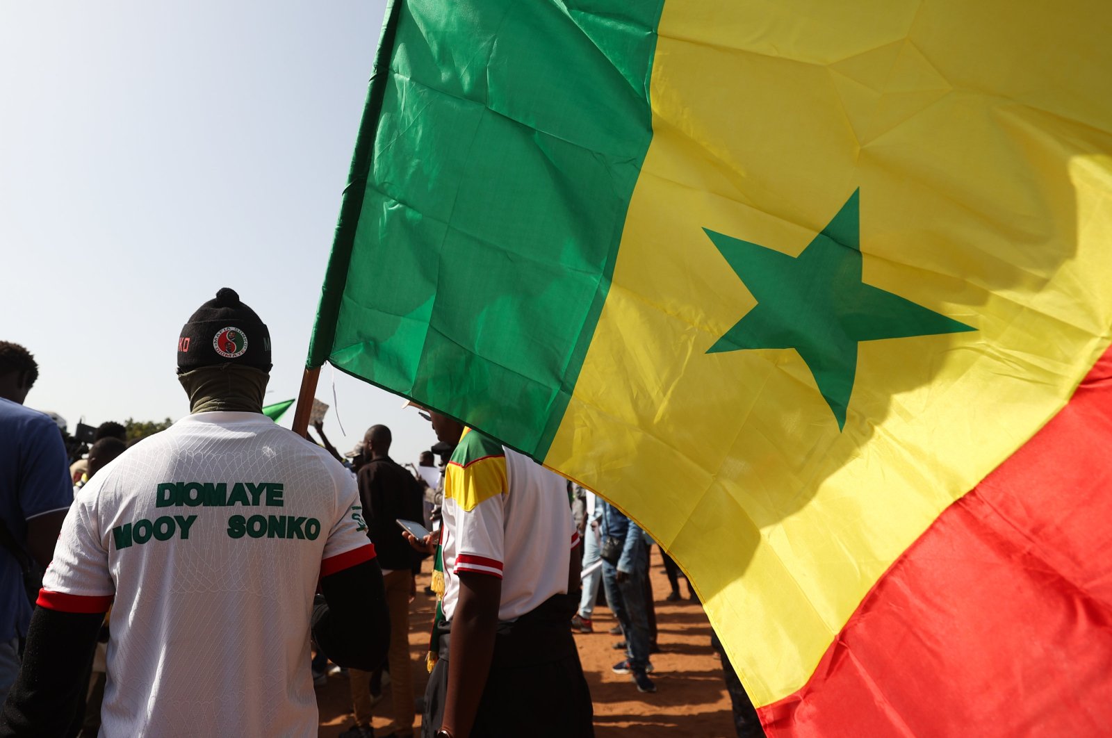 A demonstrator raises Senegal's national flag during a march in Dakar, Senegal, March 2, 2024. (AFP Photo)