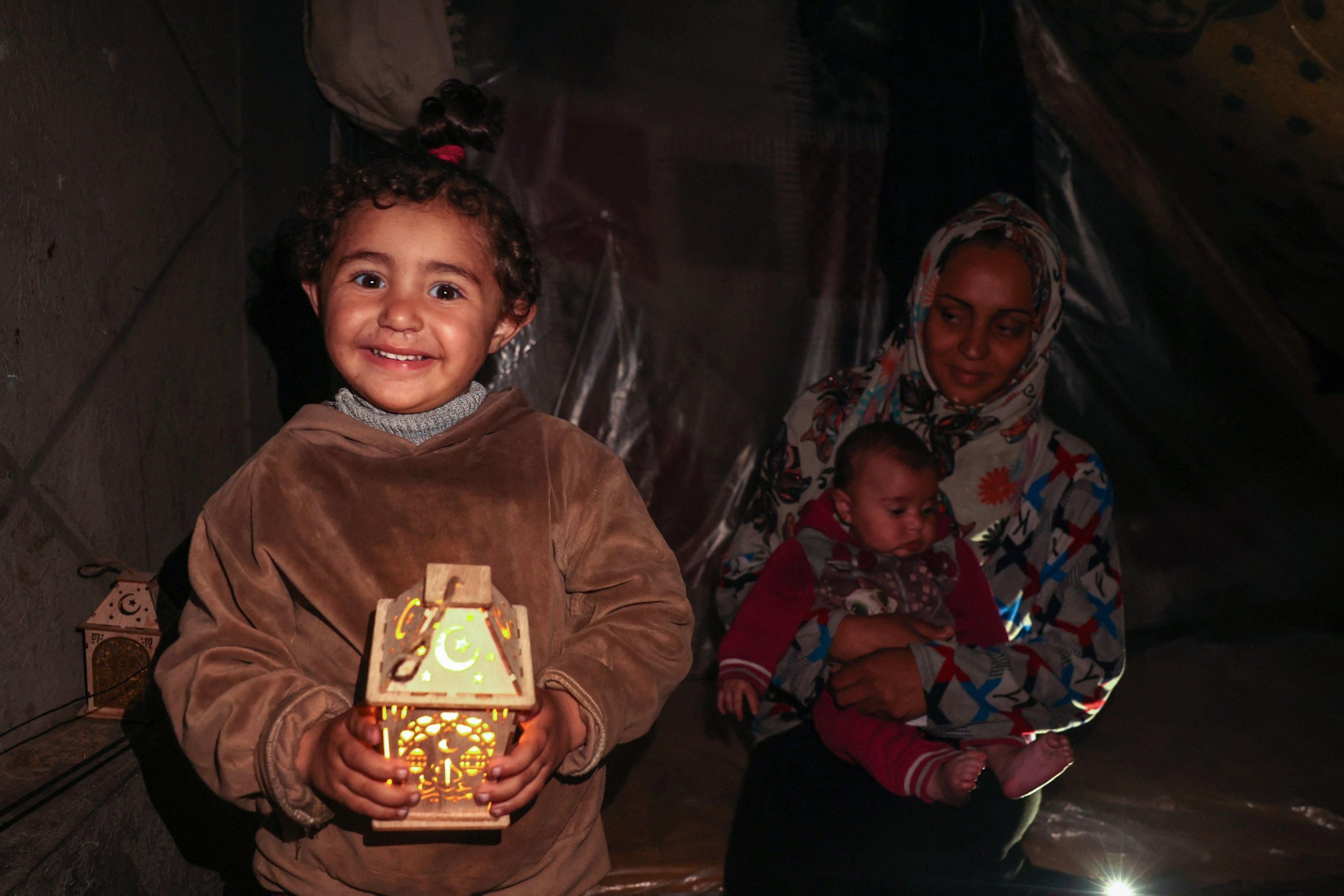 318579 Palestinian children play with traditional