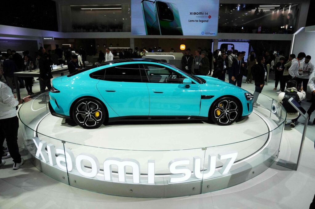 Smart car model SU7 Max by Xiaomi is displayed at the Chinese company's stand during the Mobile World Congress (MWC), the telecom industry's biggest annual gathering, Barcelona, Spain, Feb. 26, 2024. (AFP Photo)