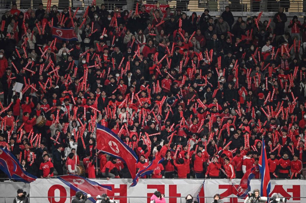 North Korean fans cheer after their team scored their first goal in the second half during the 2024 Olympic qualifying women's match between Japan and North Korea, National Stadium, Tokyo, Japan, Feb. 28, 2024. (AFP Photo)