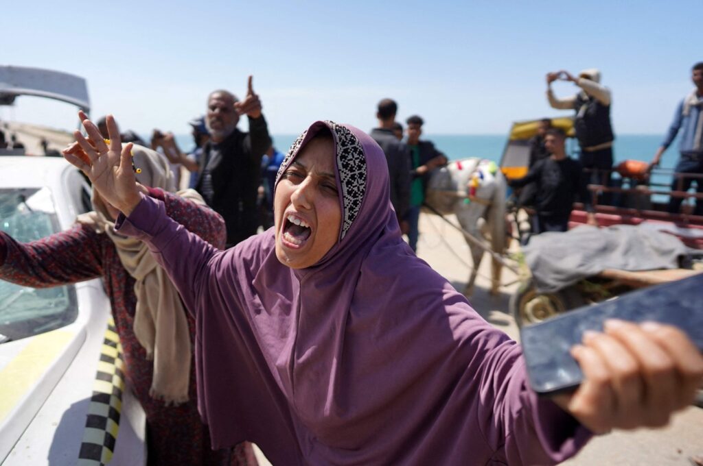 People react upon seeing the corpses of relatives killed in Israeli bombardment in Al-Zahra, Gaza Strip, Palestine, March 21, 2024. (Photo by AFP)