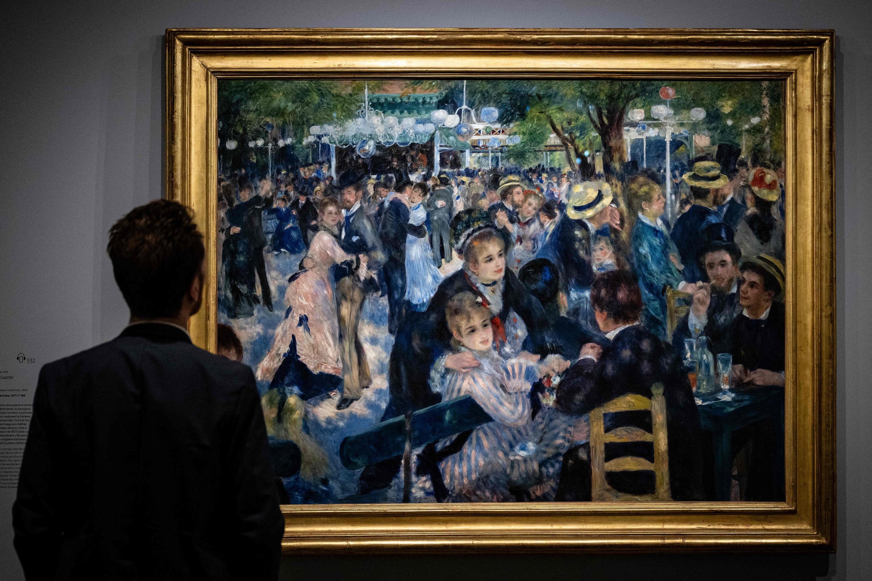 320839 A visitor looks at the painting
