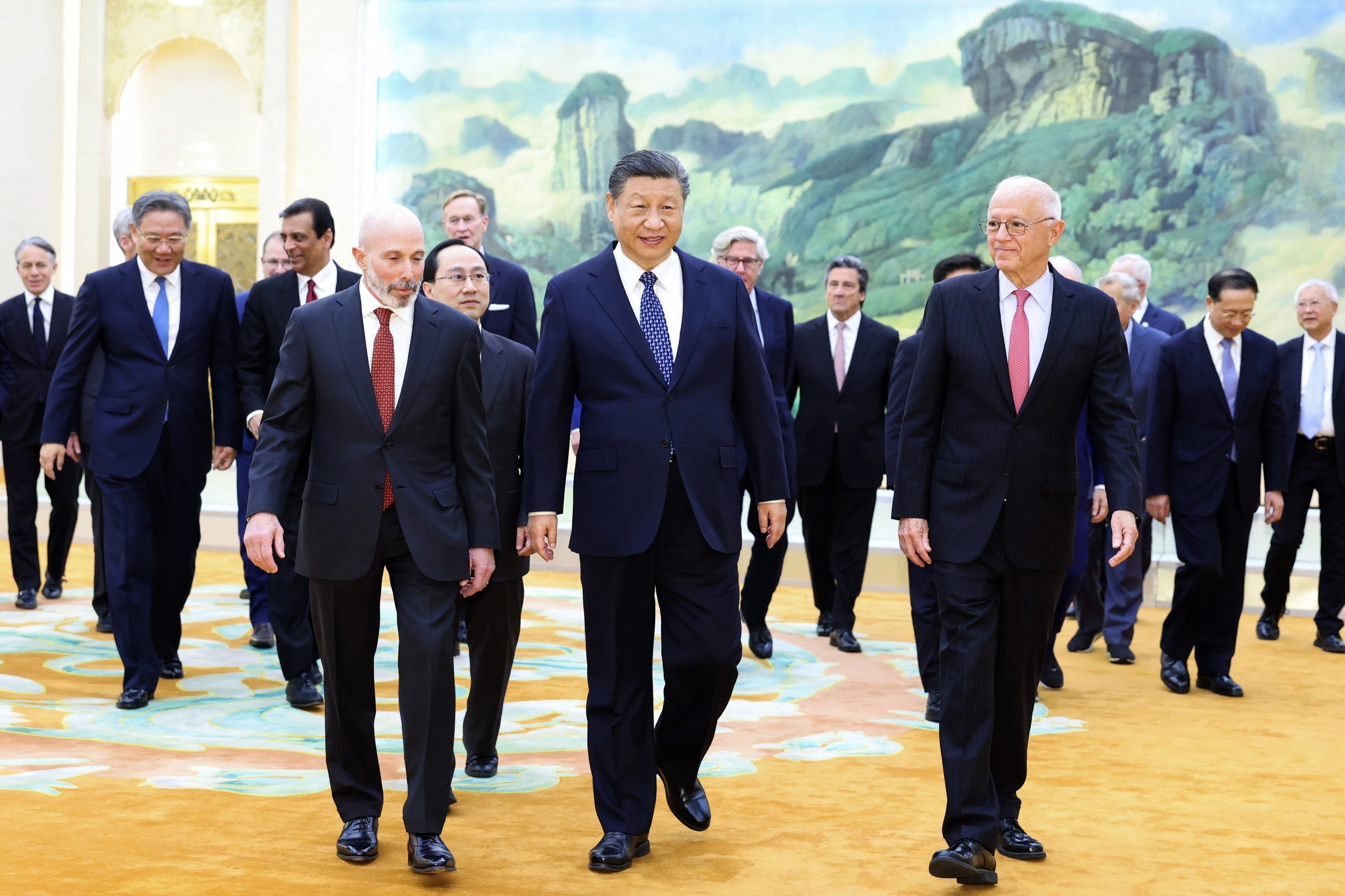 321323 Chinese President Xi Jinping (C) walks with representatives from American business, strategic and academic communities at the Great Hall of the People in Beijing, China, March 27, 2024. (Xinhua via AP)
