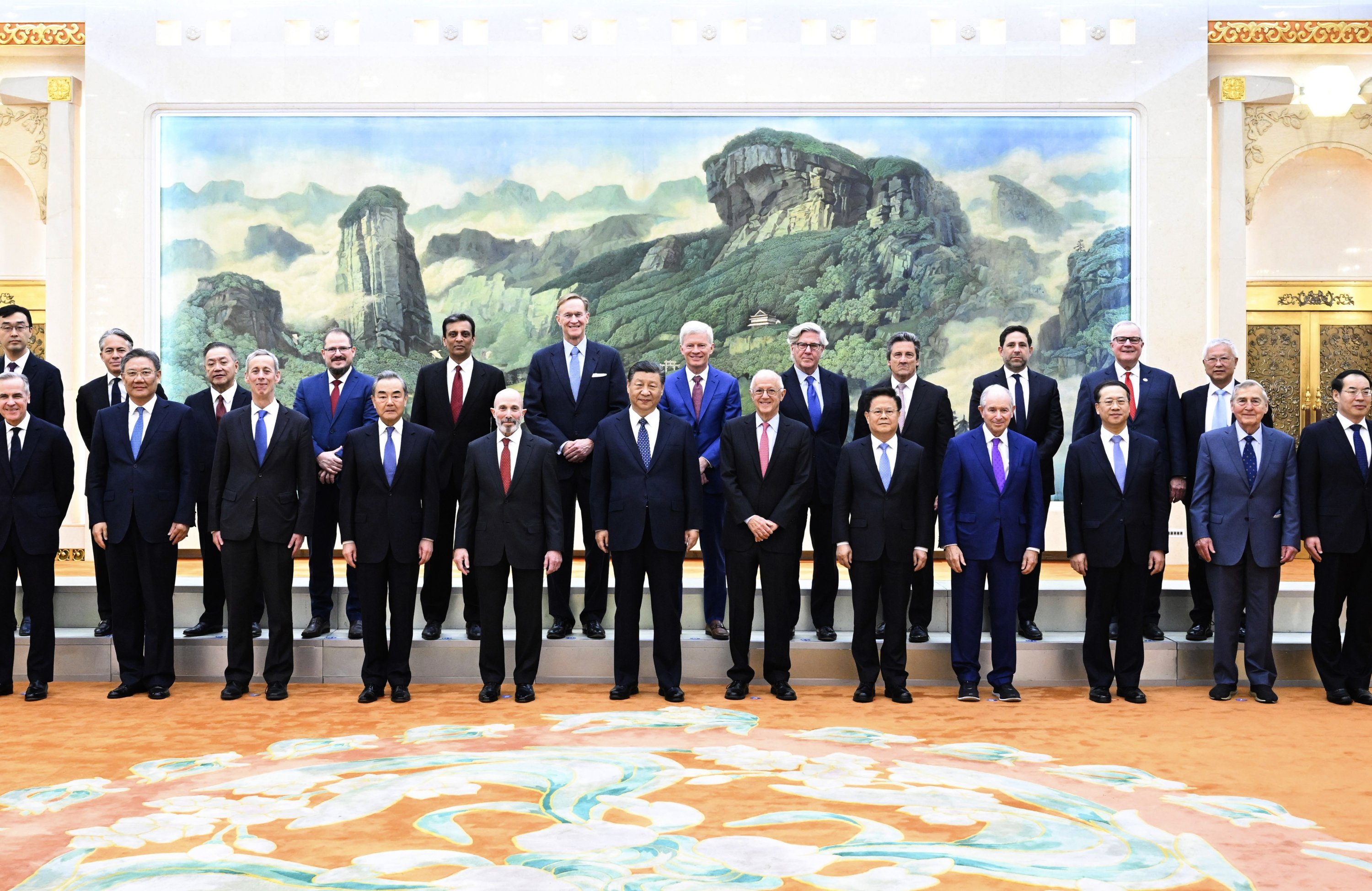 321324 Chinese President Xi Jinping (C) poses for photos with representatives from American business, strategic and academic communities at the Great Hall of the People in Beijing, China, March 27, 2024. (Xinhua via AP)
