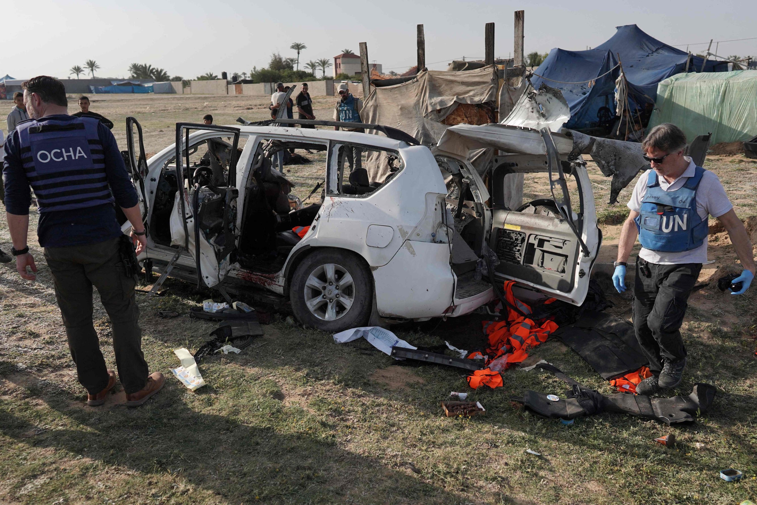 322130 United Nations staff members inspect the carcass of a car used by US-based aid group World Central Kitchen, that was hit by an Israeli strike the previous day between Deir Al Balah and Khan Younis, Gaza Strip, Palestine, April 2, 2024. (AFP Photo)