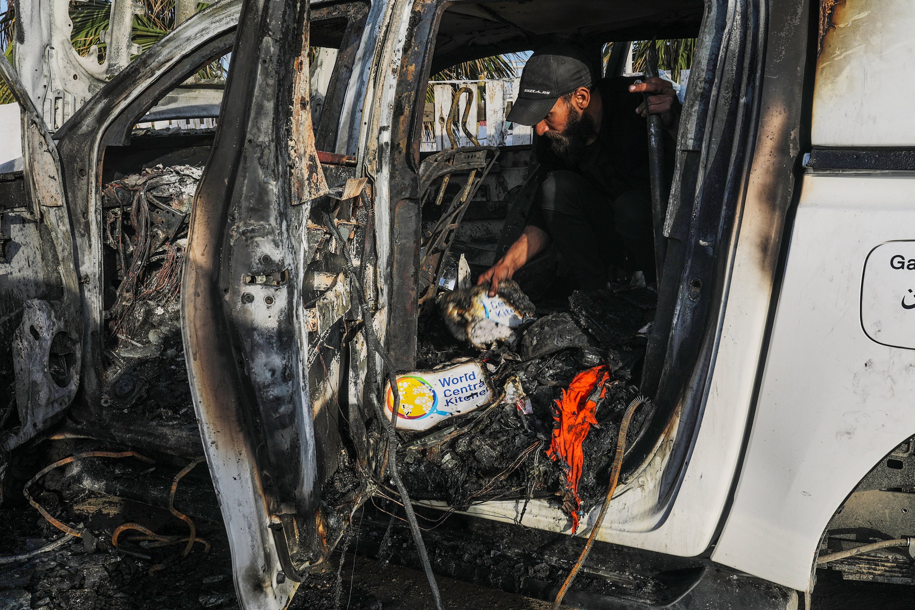 322131 A man examines the interior of a destroyed car of the NGO World Central Kitchen (WCK) along Al Rashid road, between Deir Al Balah and Khan Younis, Gaza Strip, Palestine, April 2, 2024. (EPA Photo)