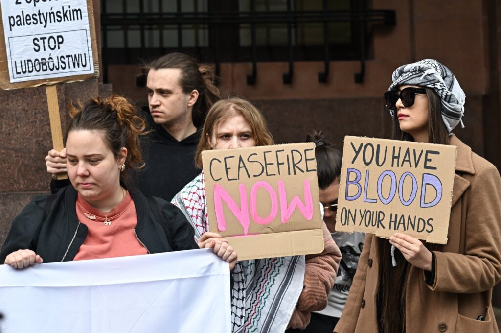 Demonstrators hold placards during a protest outside the Ministry of Foreign Affairs, Warsaw, Poland, April 5, 2024. (EPA Photo)
