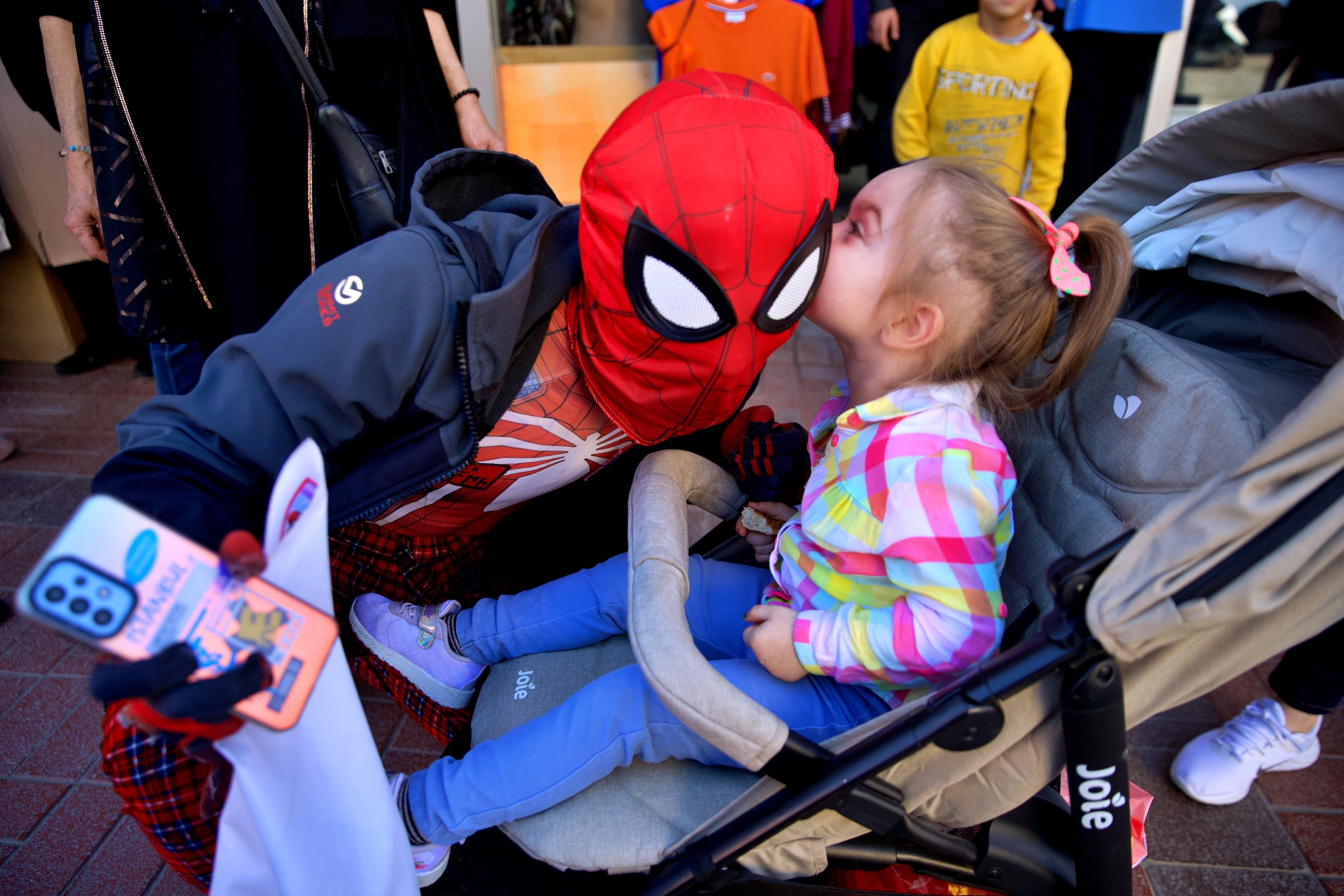 323270 A girl kisses Ayaz Koç, dressed as Spider-Man, Osmaniye, southern Türkiye, March 30, 2024. (AA Photo)
