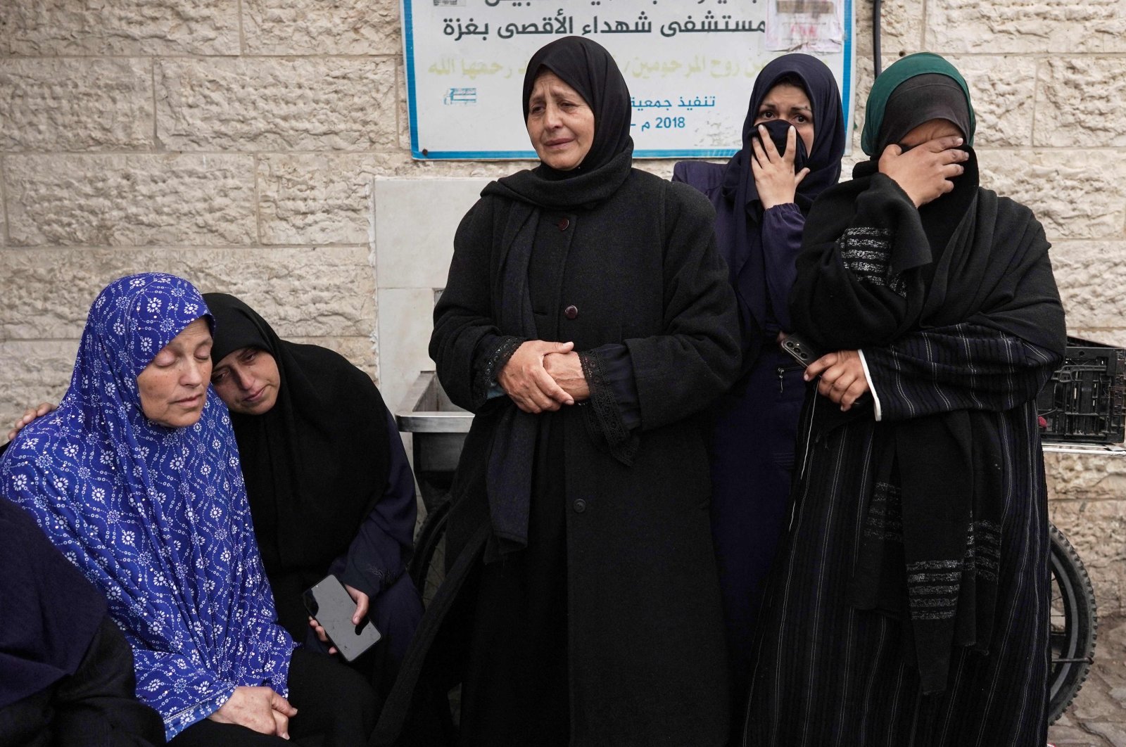 Palestinian women mourn victims from one family killed in an overnight Israeli bombardment on the Nuseirat refugee camp in central Gaza on the first day of the Eid al-Fitr festival, at the Al-Aqsa Martyrs Hospital, Deir al-Balah, Palestine, April 10, 2024. (AFP Photo)