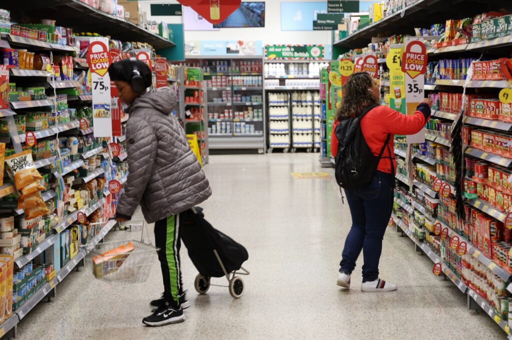 People shop at a store in London, Britain, March 20, 2024. (EPA Photo)