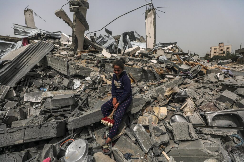 A Palestinian girl sits among the rubble of a house after returning to Al Nusairat refugee camp following the Israeli army's retreat from the area, Gaza Strip, Palestine, April 18, 2024. (EPA Photo)
