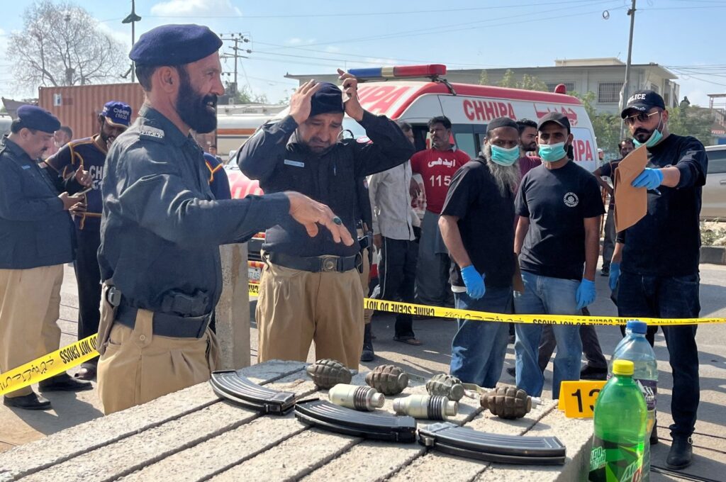 Police officers survey the site after a suicide blast, Karachi, Pakistan, April 19, 2024. (Reuters Photo)