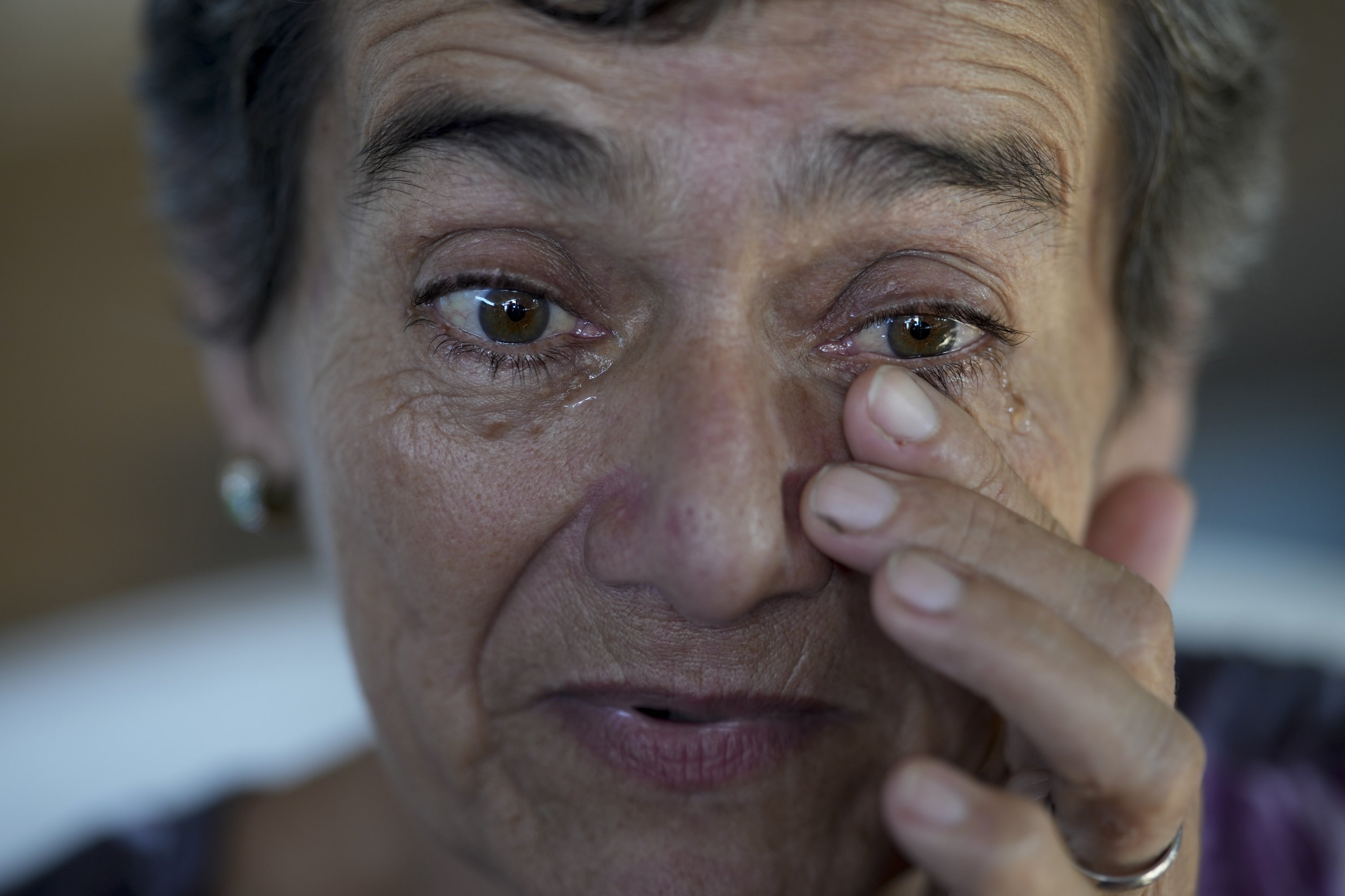 324475 Geronima Benitez wipes her eyes as she speaks about her son Victor Emanuel, 17, who was murdered by drug traffickers who were never arrested two years ago, during an interview at her home, Rosario, Argentina, April 9, 2024. (AP Photo)