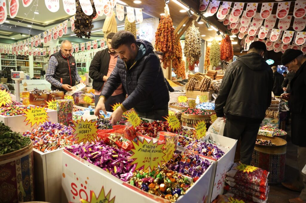 A trader and costumers conduct business at a historic bazaar in eastern Elazığ province, Türkiye, April 9, 2024. (IHA Photo)