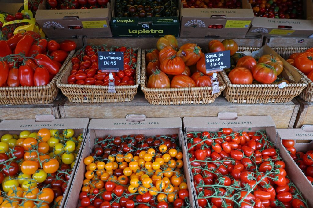 Varieties of tomatoes are displayed for sale at Panzer's Delicatessen and Grocery in London, Britain, March 26, 2024. (Reuters Photo)