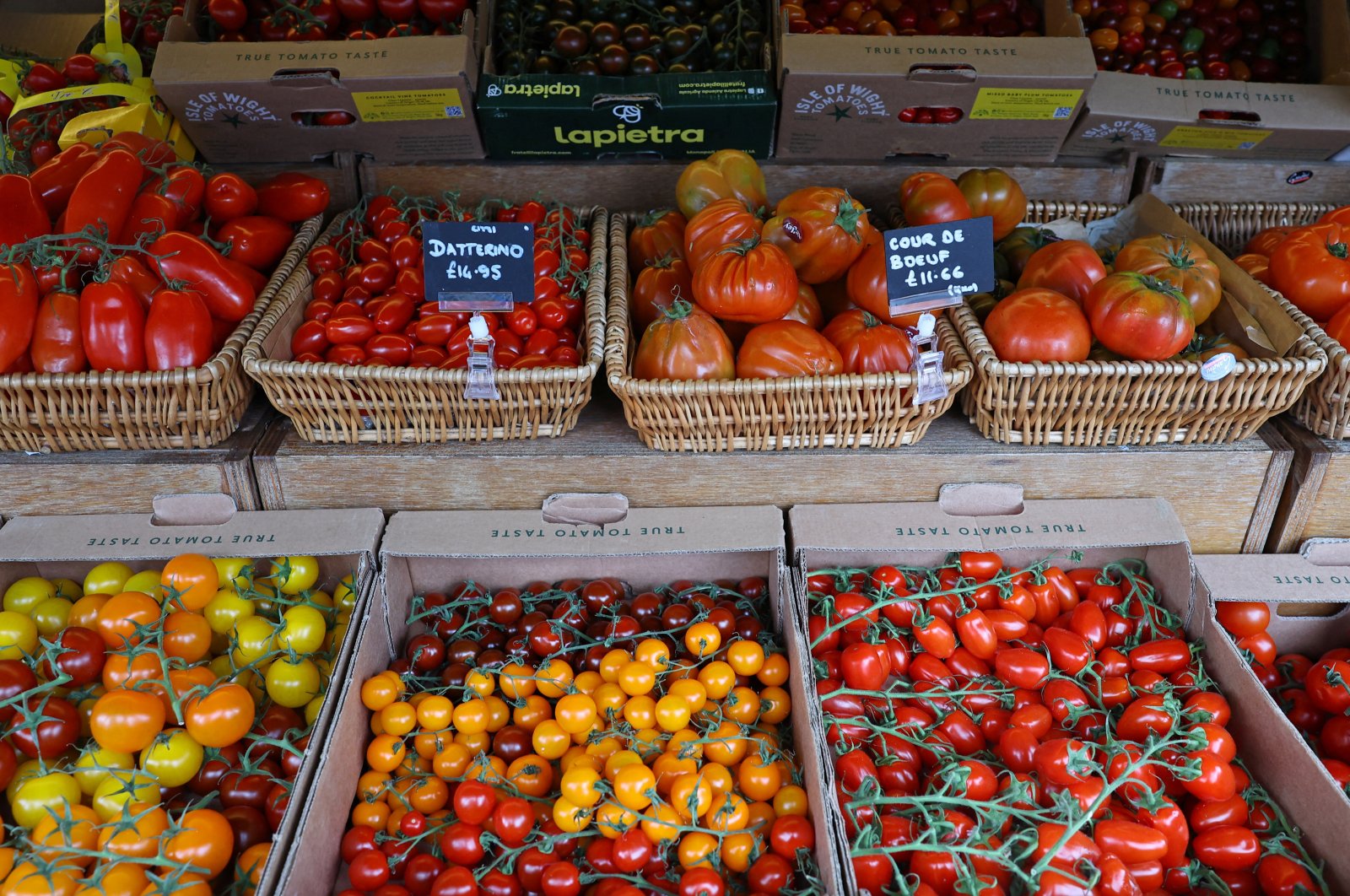 Varieties of tomatoes are displayed for sale at Panzer's Delicatessen and Grocery in London, Britain, March 26, 2024. (Reuters Photo)
