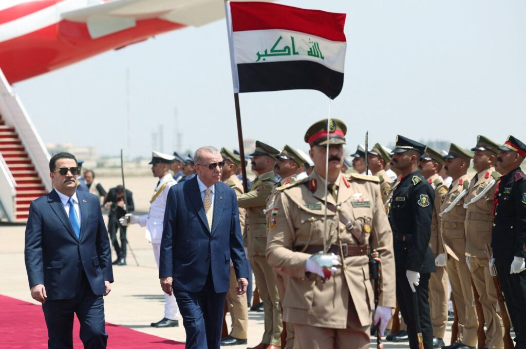 Iraq's Prime Minister Mohammed S. Al Sudani (L) welcomes President Recep Tayyip Erdoğan (C) upon his arrival at the Baghdad International Airport at the start of his official visit, Baghdad, Iraq, April 22, 2024. (AFP Photo)