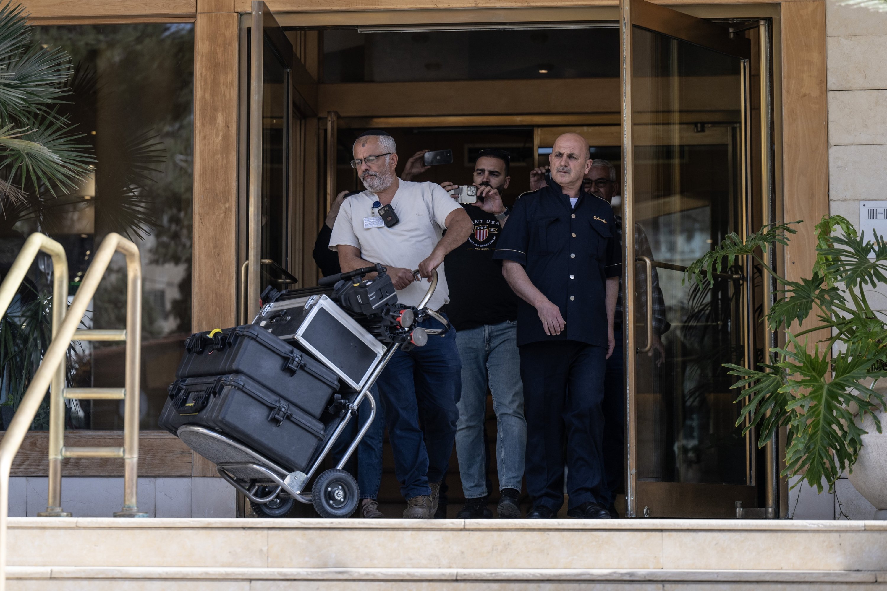 326536 Israeli security personnel confiscate Al Jazeera's equipment from its local office in occupied East Jerusalem, May 5, 2024. (AA Photo)
