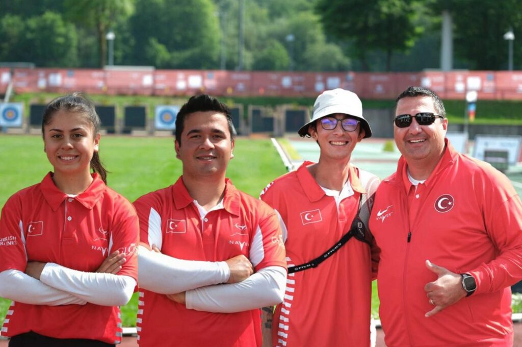 From left to right, Turkish archery team of Hazla Burun, Emircan Haney, Mete Gazoz and their coach pose for a photo during the European Archery Championships, Essen, Germany, May 10, 2024. (AA Photo)