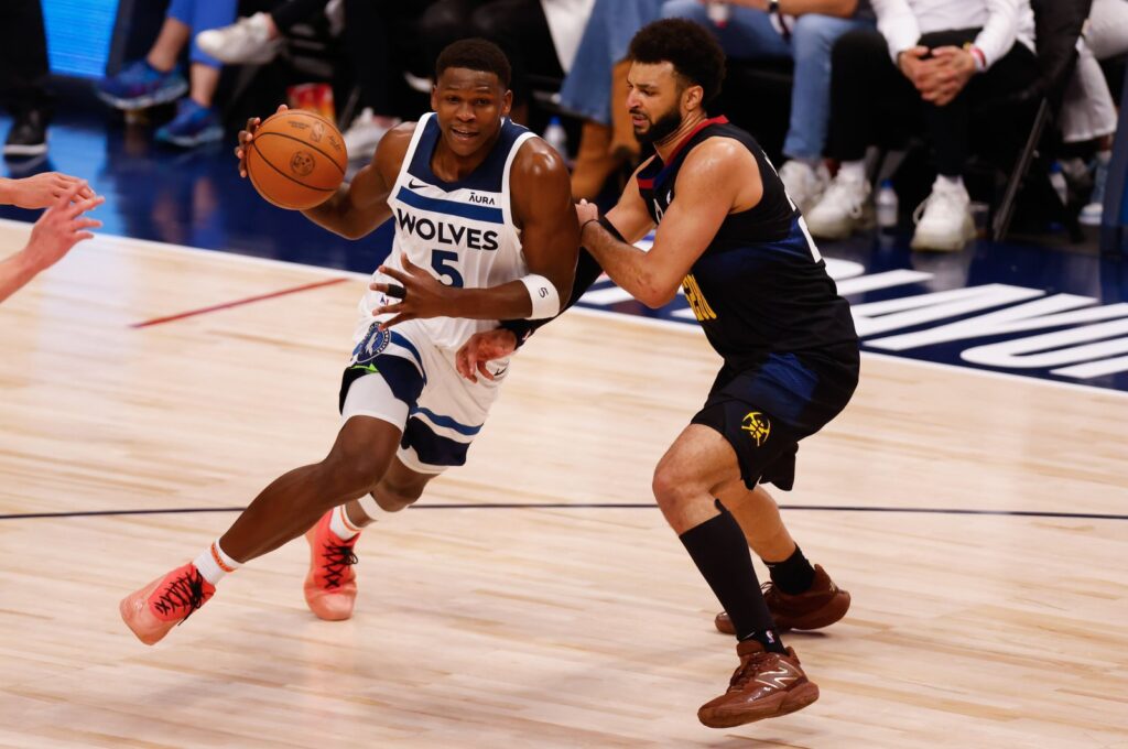 Minnesota Timberwolves guard Anthony Edwards (L) drives to the basket against Denver Nuggets guard Jamal Murray during the third quarter of game five of the Western Conference semifinal series, Denver, Colorado, U.S., May 14, 2024. (EPA Photo)