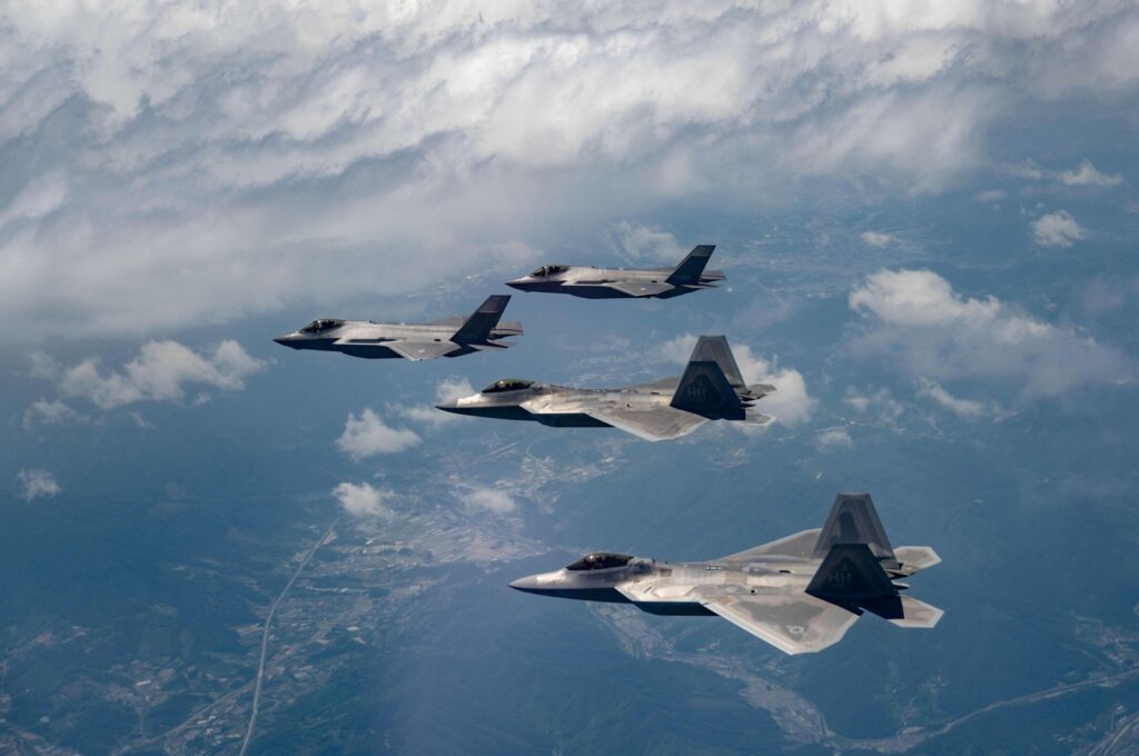 This handout photo provided by the South Korean Defense Ministry shows two U.S. Air Force F-22 fighter jets (front) flying with two South Korean Air Force F-35A fighter jets during a joint air drill in South Korea, May 16, 2024. (AFP Photo)