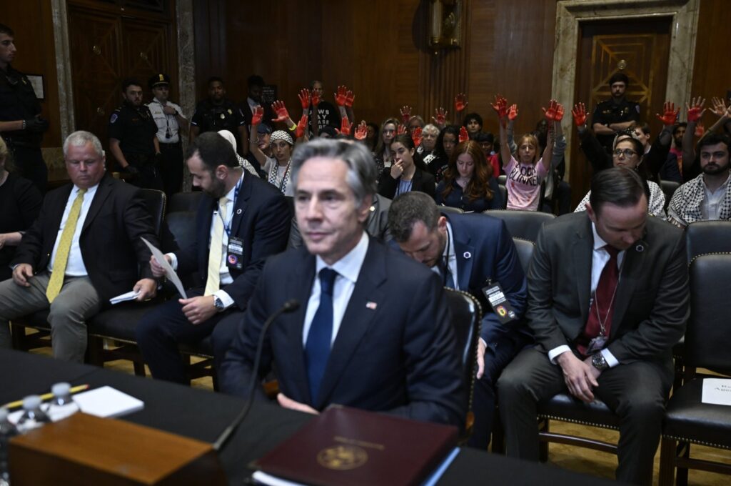 Pro-Palestinian demonstrators show their red-painted hands as they interrupt U.S. Secretary of State Antony Blinken's testimony before the U.S. Senate Foreign Relations Committee at the Capitol, in Washington, D.C., May 21, 2024. (AA Photo)