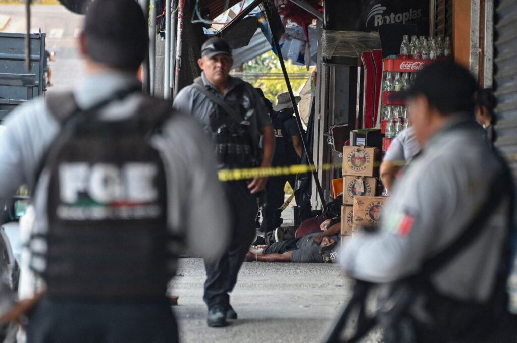 Investigators from the prosecutor's office, state police, and forensic personnel work at a crime scene where five people were murdered in Acapulco, Guerrero State, Mexico, May 23, 2024. (AFP Photo)