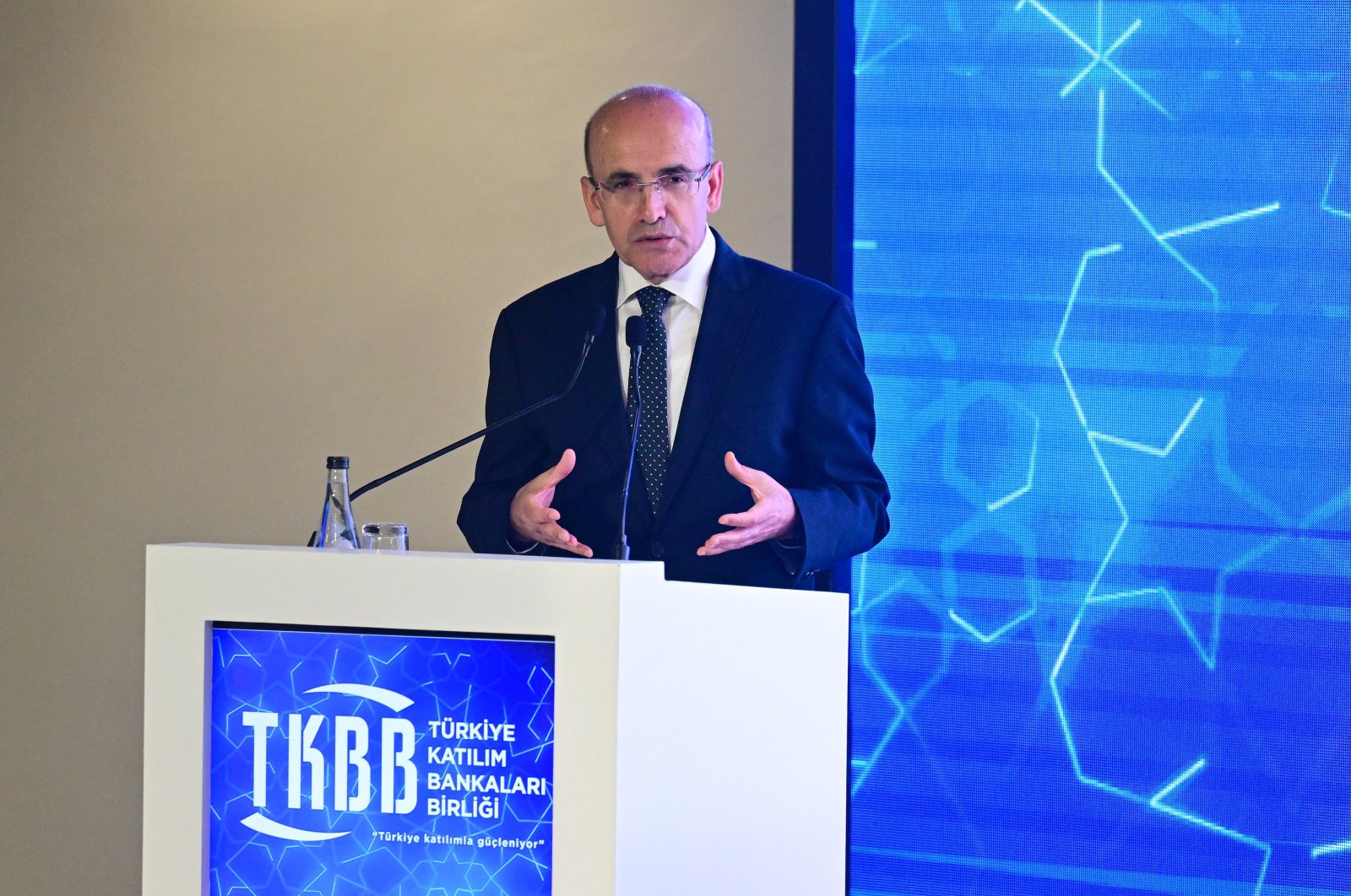 Treasury and Finance Minister Mehmet Şimşek speaks during an event in Istanbul, Türkiye, May 23, 2024. (AA Photo)