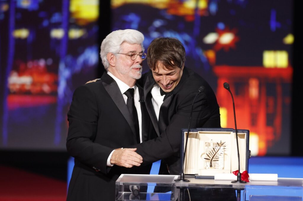 Sean Baker (R) receives the Palme D'Or Award for "Anora" from George Lucas (L) during the closing and awards ceremony of the 77th annual Cannes Film Festival, Cannes, France, May 25, 2024. (EPA Photo)