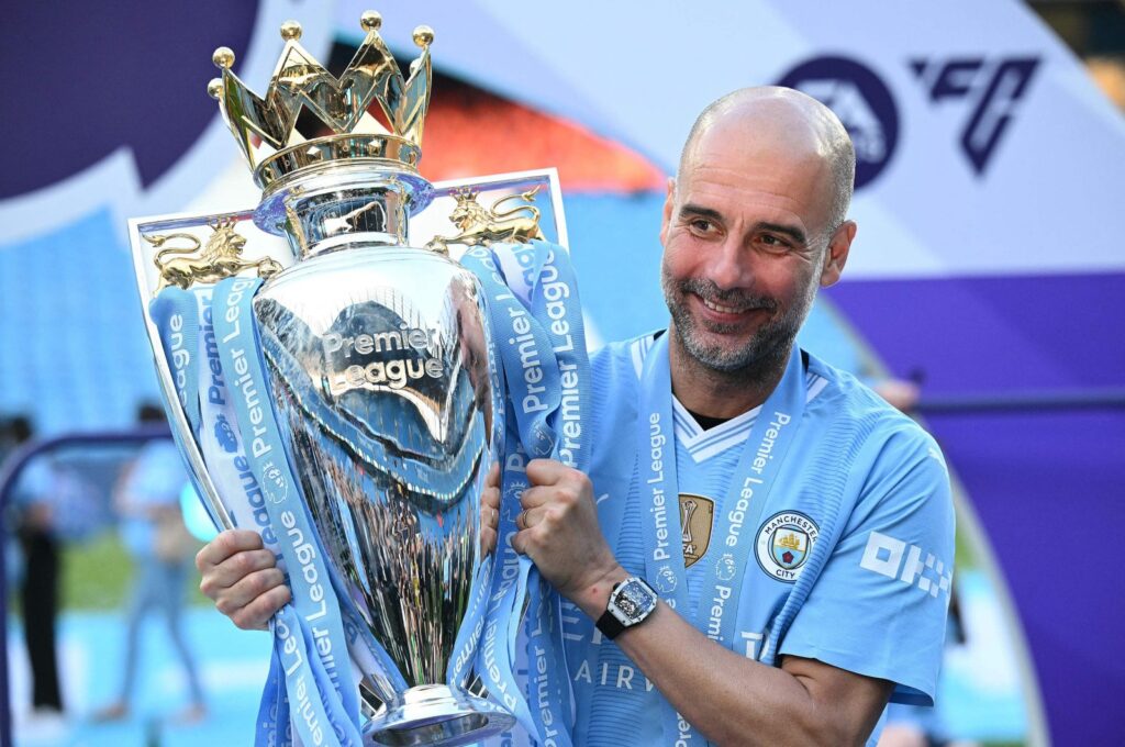 Manchester City's manager Pep Guardiola poses with the Premier League trophy after the presentation ceremony following the English Premier League football match against West Ham United at the Etihad Stadium, Manchester, U.K., May 19, 2024. (AFP Photo)