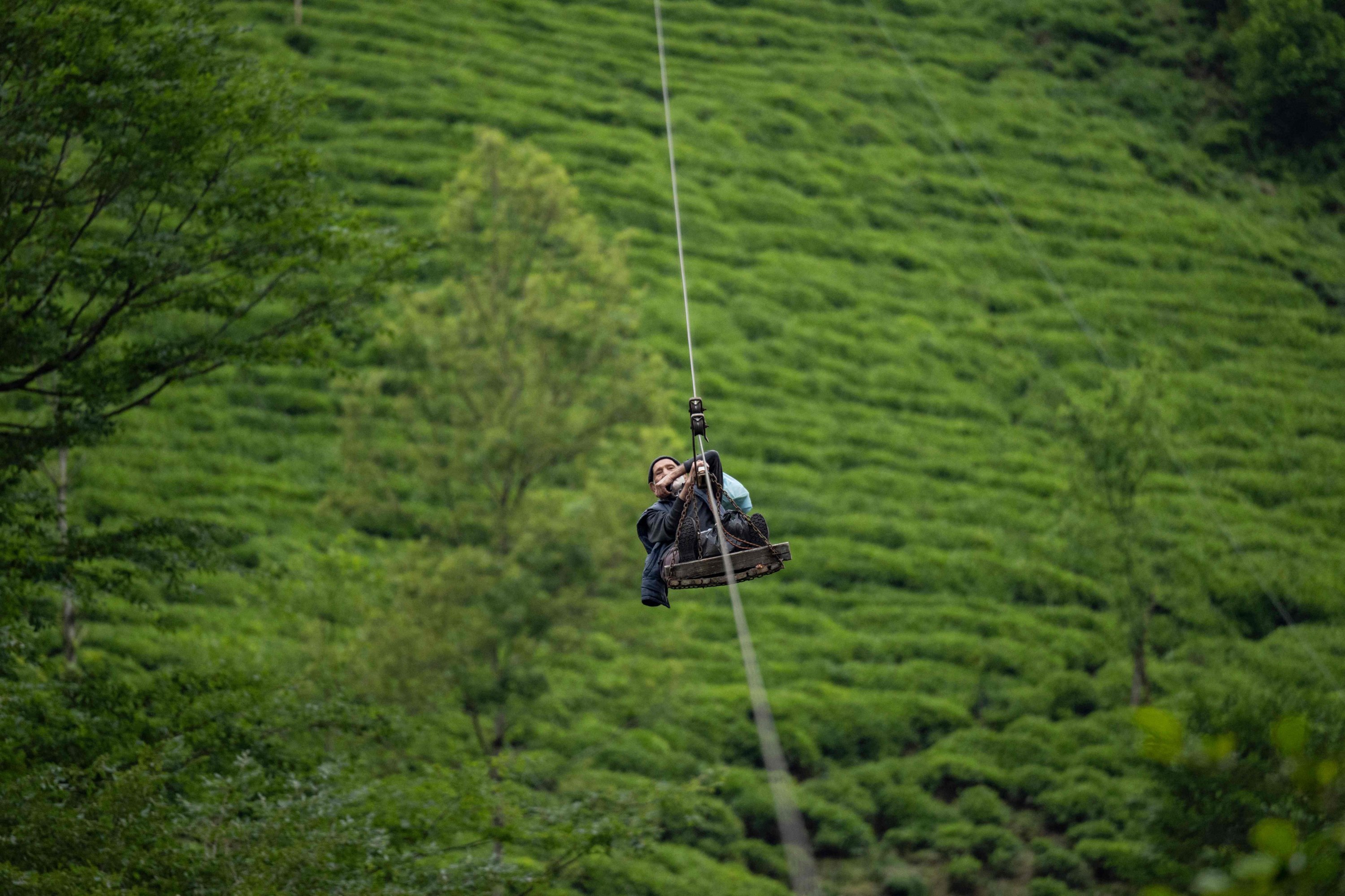 329988 Kasım Karaosman, 90, goes home every day using the cable car of the village of Selamet, in the northeastern province of Rize, Türkiye, May 10, 2024. (AFP Photo)