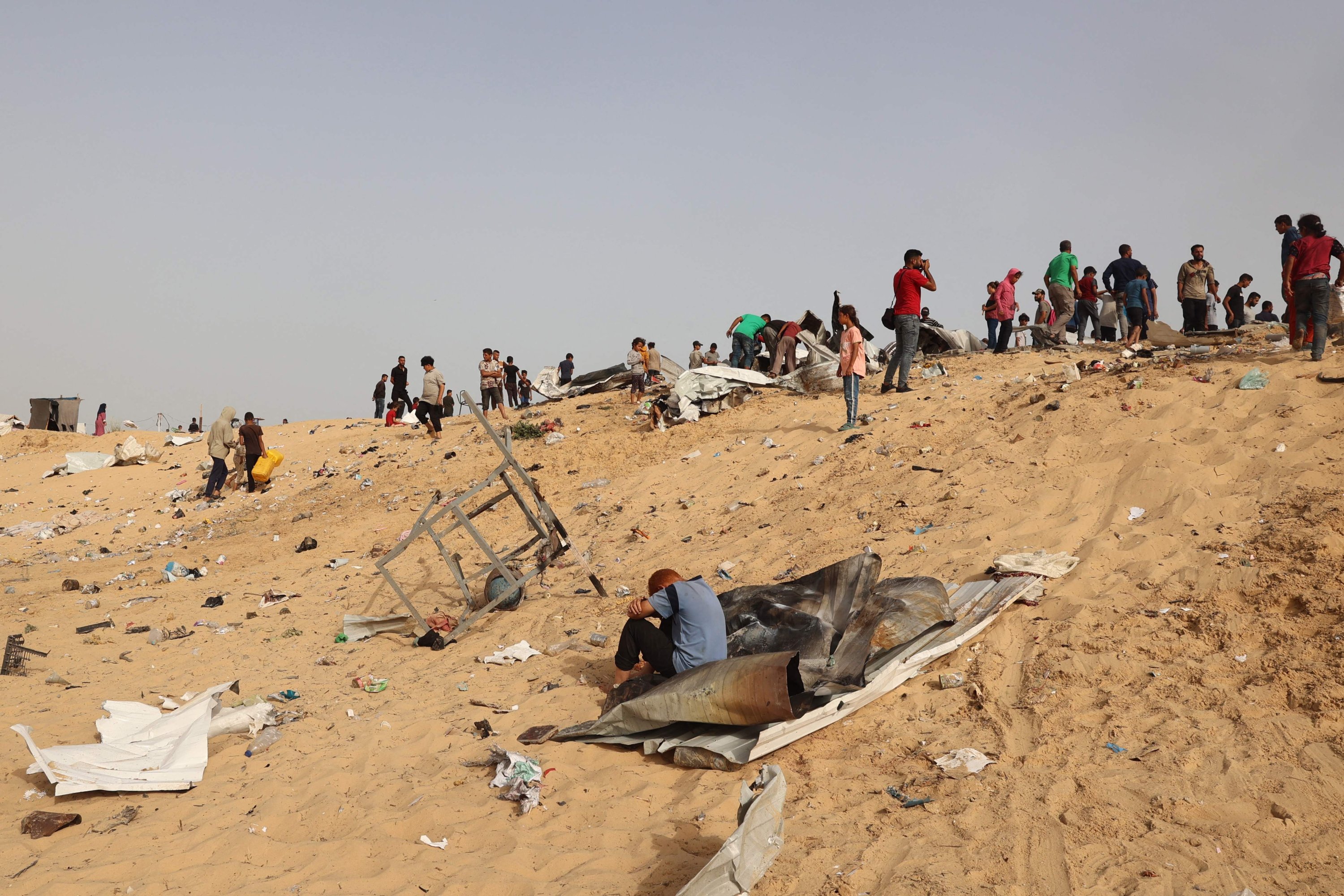 330011 Palestinians gather at the site of an Israeli strike on a camp for internally displaced people in Rafah, southern Gaza Strip, Palestine, May 27, 2024. (AFP Photo)