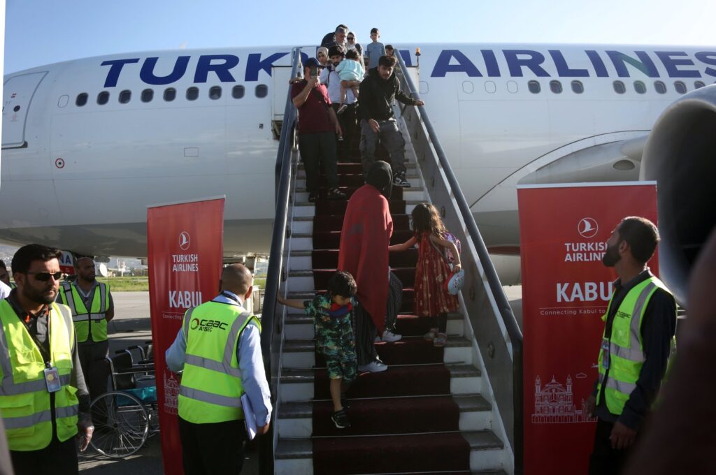 Passengers disembark from a plane after Turkish Airlines resumes operations in Kabul, Afghanistan, May 21, 2024. (EPA Photo)