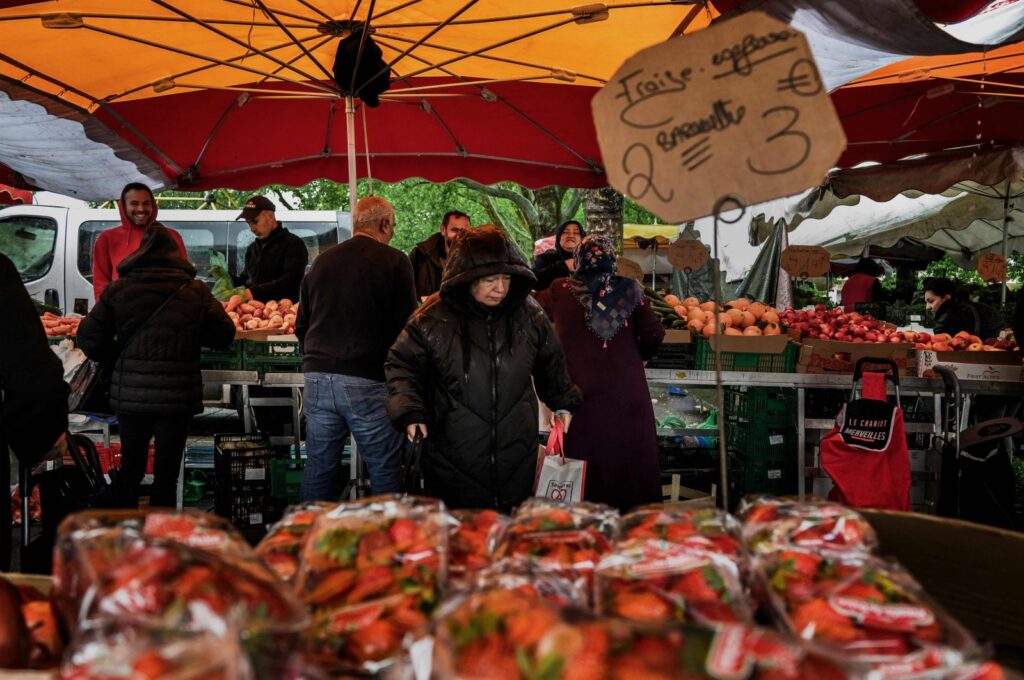 Pedestrians walk in the market of the Cronenbourg neighborhood of Strasbourg, eastern France, May 17, 2024. (AFP Photo)
