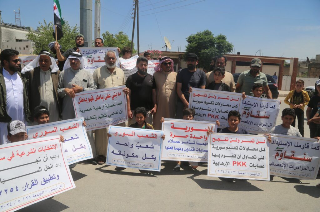 People stage a protest against the PKK/YPG's "elections" in Tal Abyad, Syria, May 31, 2024. (AA Photo)