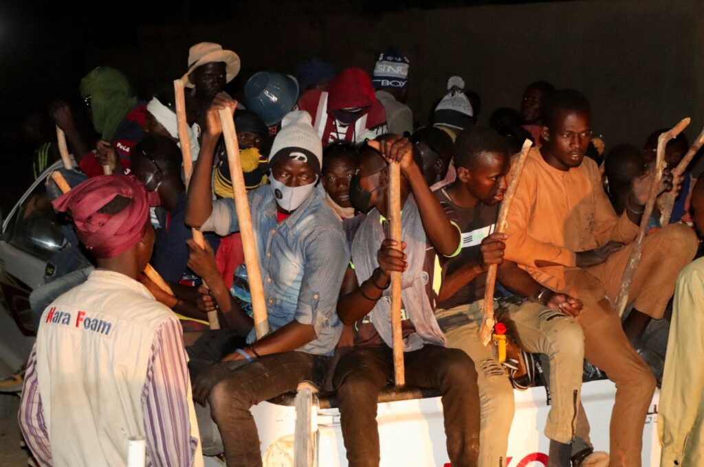 Migrants sit in the back of a truck, as they prepare to travel to Libya, Agadez, Niger, April 23, 2024. (Reuters Photo)