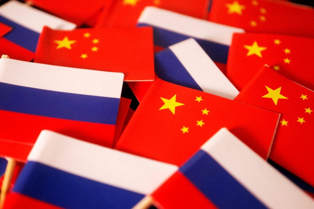 Flags of China and Russia are displayed in this illustration picture taken, March 24, 2022. (Reuters Photo)