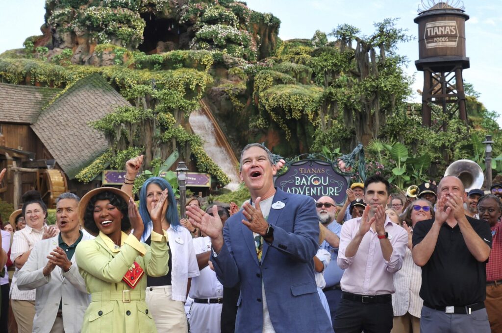 With Princess Tiana, Walt Disney World President Jeff Vahle cheers employees during a "Thank You Fête" honoring cast members at a preview event for Tiana's Bayou Adventure at the Magic Kingdom in Bay Lake, Florida, U.S., June 10, 2024. (AP Photo)