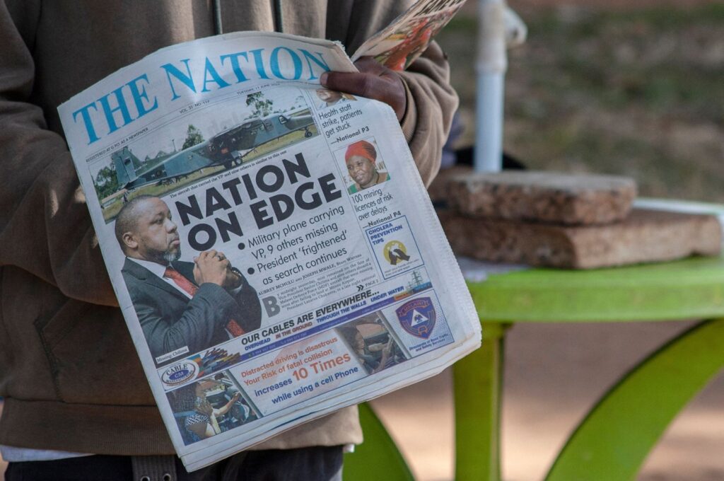 A newspaper vendor holds The Nation newspaper with a cover picture of the missing plane Vice State President Saulos Klaus Chilima in Lilongwe, Malawi, June 11, 2024. (AFP Photo)